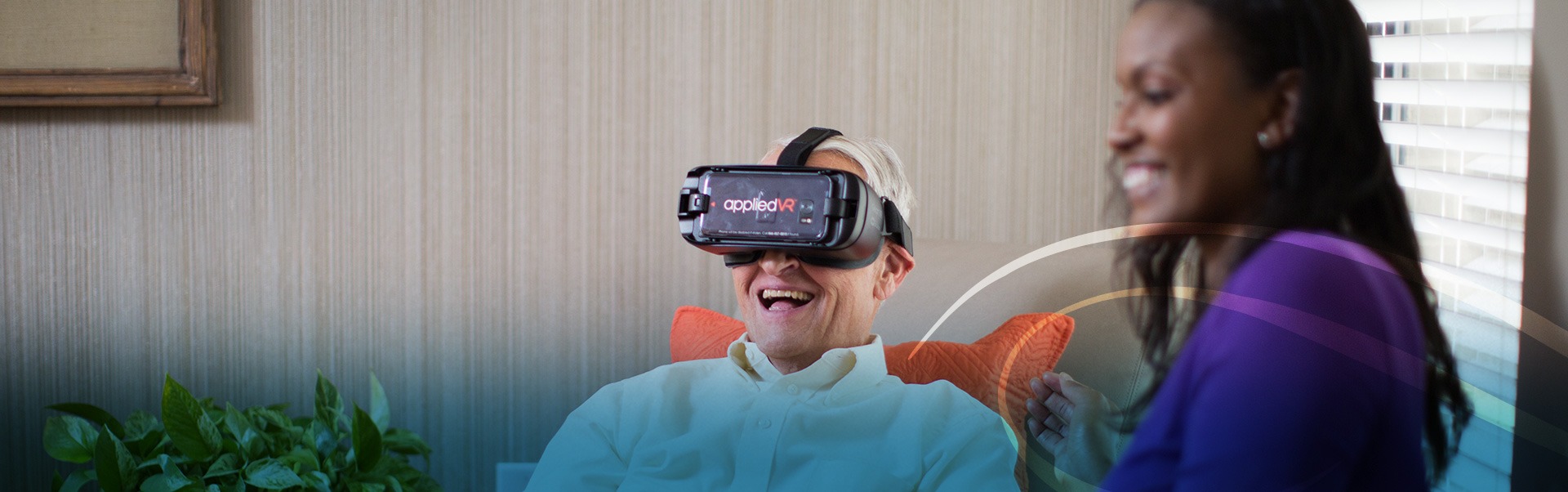 Man smiling and wearing Applied VR headset as part of neurological care