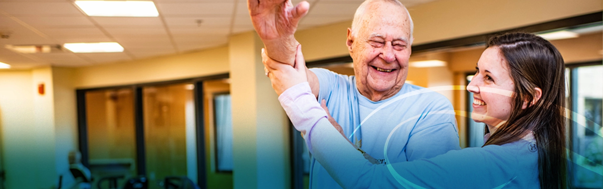 Trainer assisting elderly man with stretches at gym in rehab facility